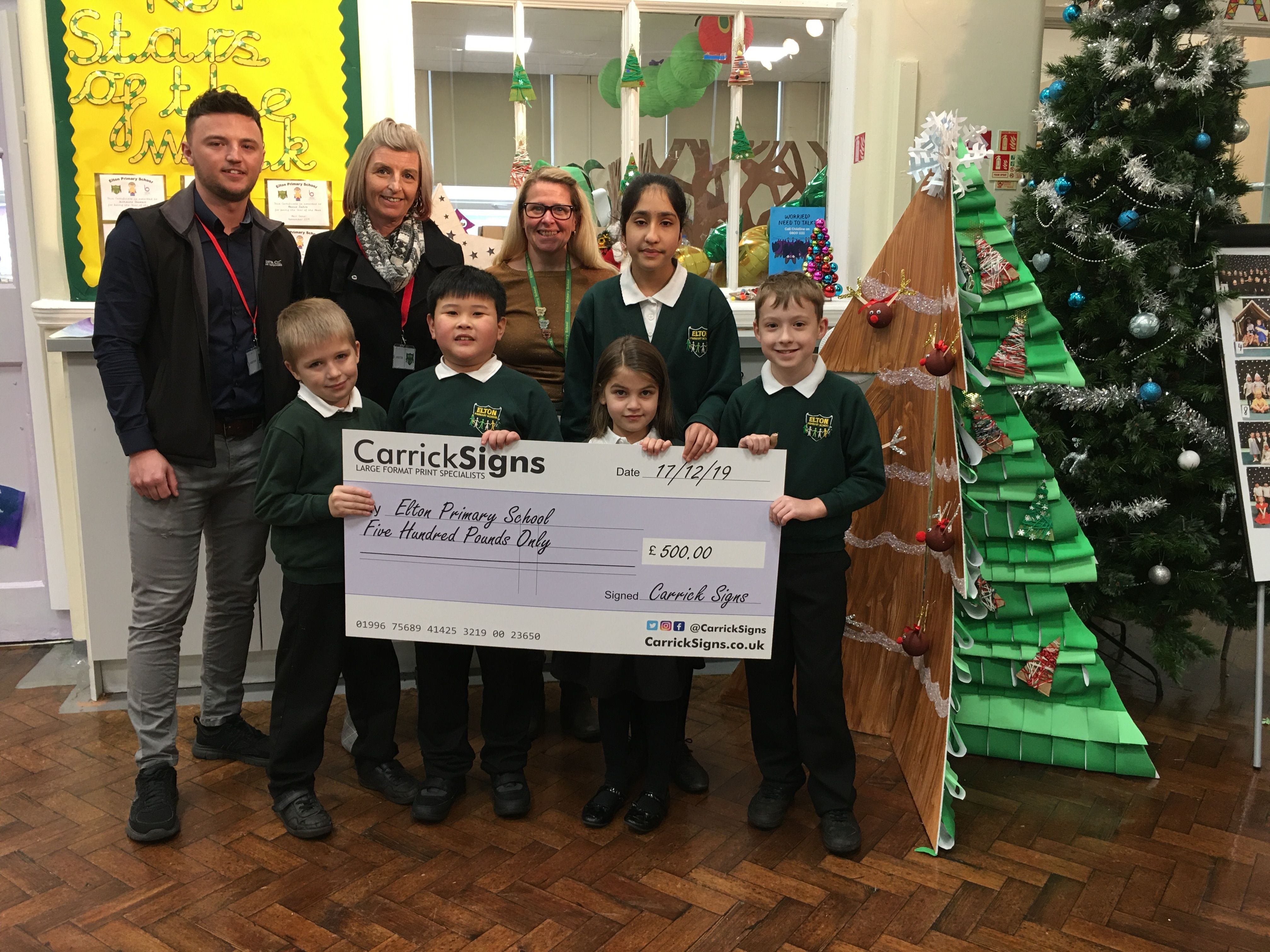 Carrick Signs presenting cheque to Elton Primary School